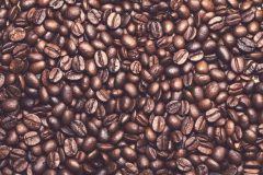 Drink, energy. Heap of coffee beans on the table